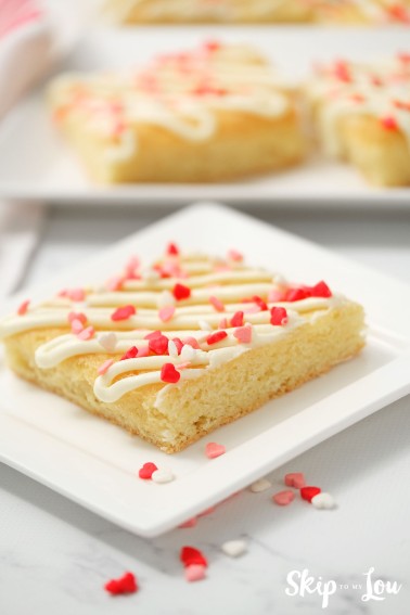 sugar cookies bars with sprinkles on white plate