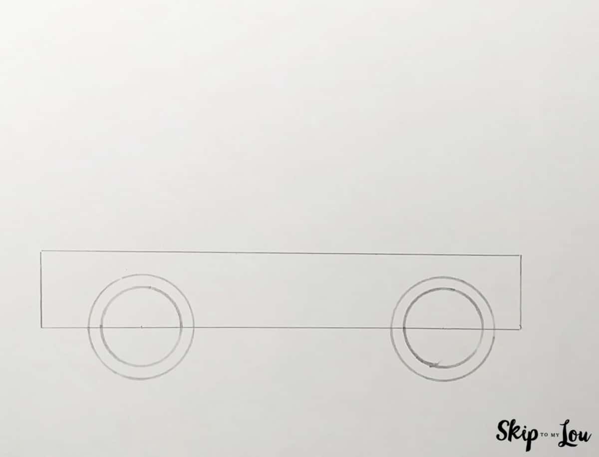 First step for drawing a car. rectangle for the body and circles for tires