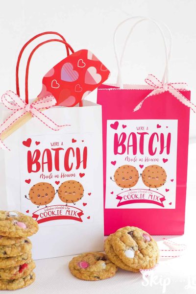 two cookie mixes in white and pink bags with we're a batch made in heaven labels