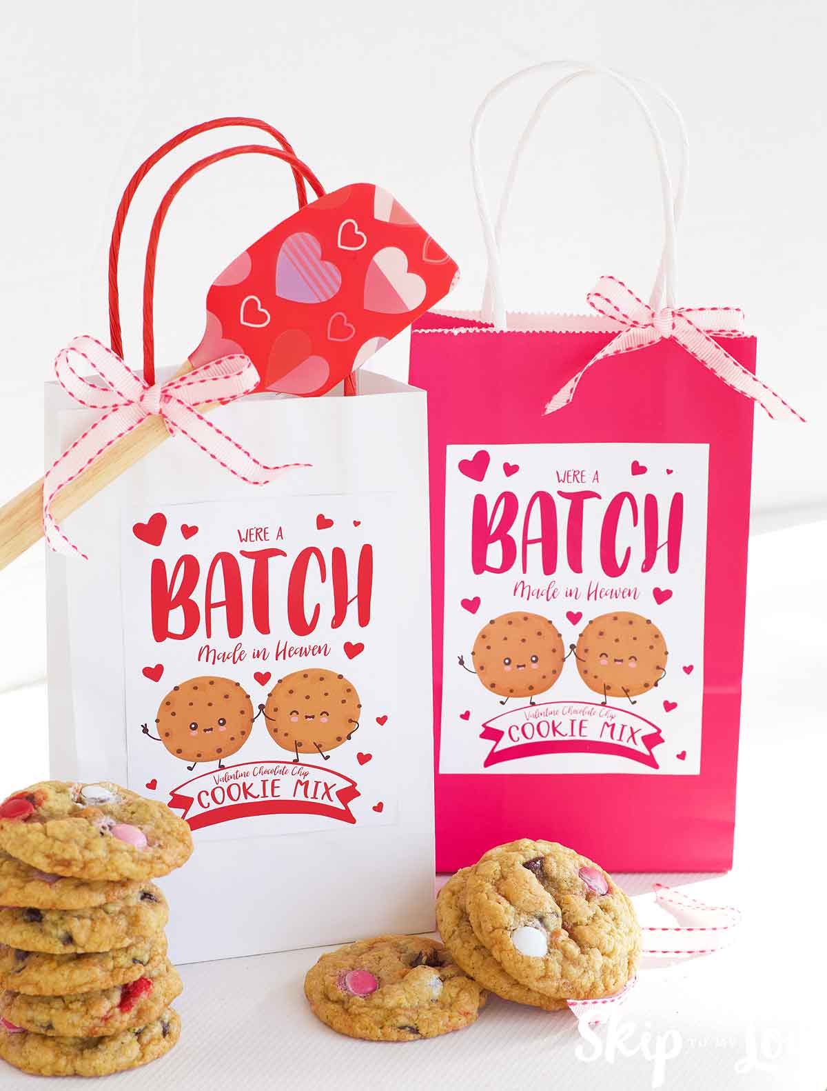 two cookie mixes in white and pink bags with we're a batch made in heaven labels
