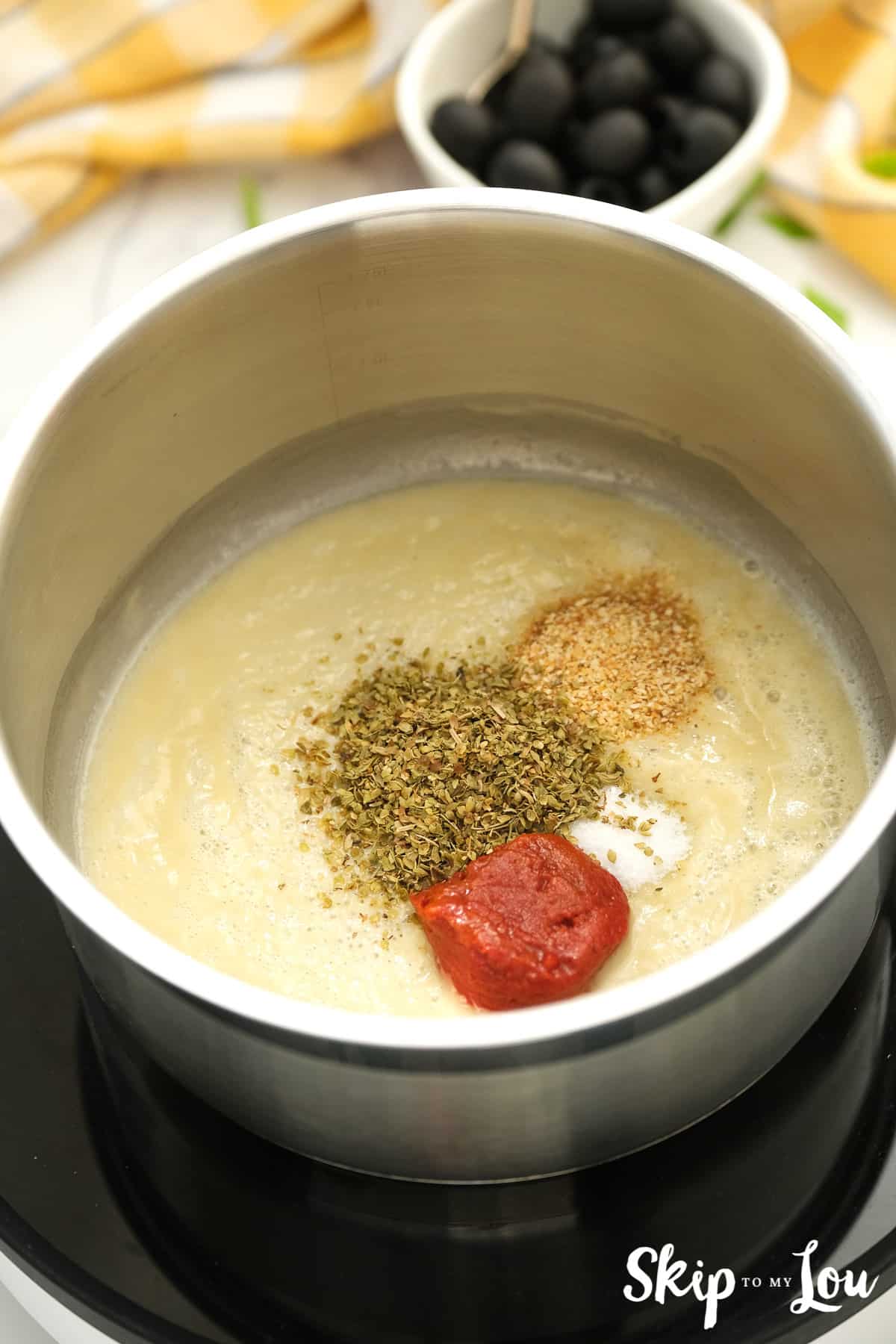 First for the vegan enchiladas whisk together oil, flour, and broth. Add spices and simmer.