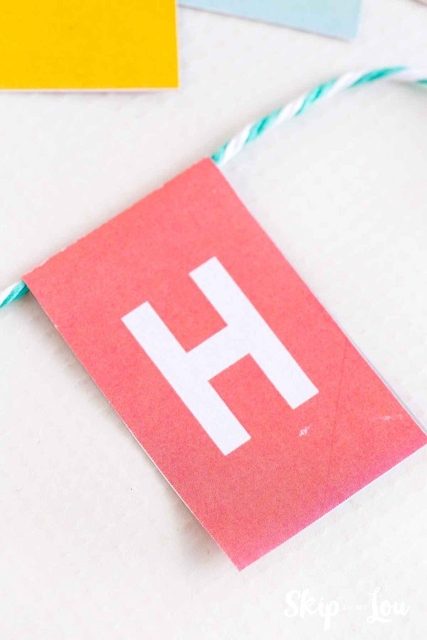 A white capital H on a red background by Skip to my Lou 