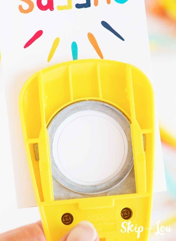 Using a circle punch for cutting circle at the top of the gift tag