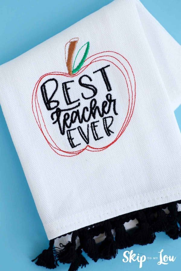 machine embroidered tea towel with best teacher ever inside an apple