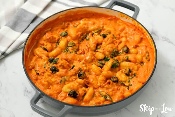 Gnocchi with tomatoes, pine nuts, and spinach