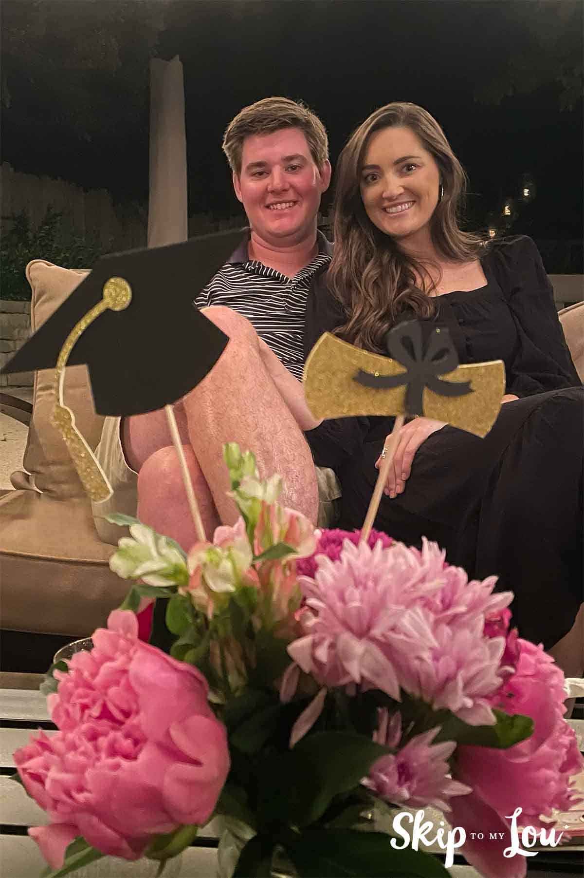 couple at graduation party with centerpiece