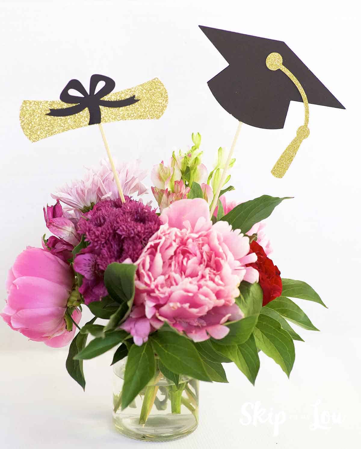 Beautiful graduation centerpiece with flowers.