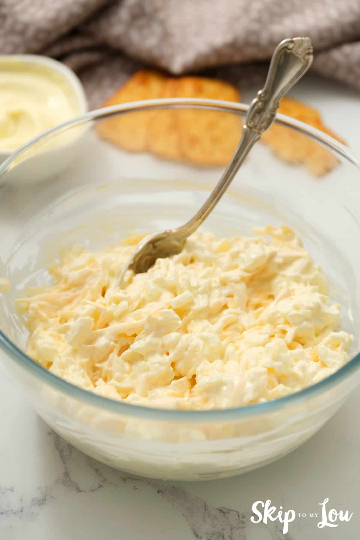Mix onion, cheese, and mayo together.