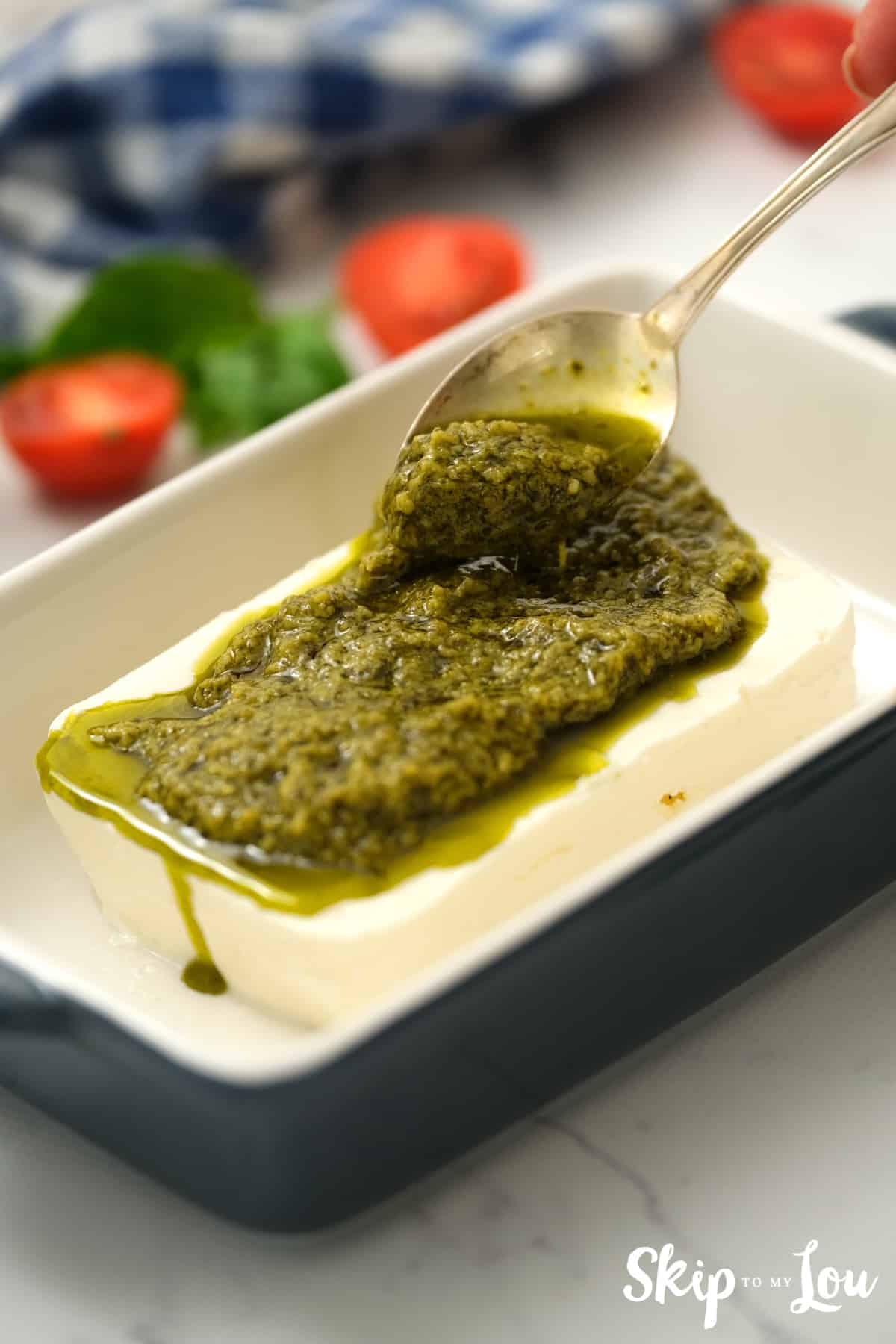 spread pesto on top of cream cheese