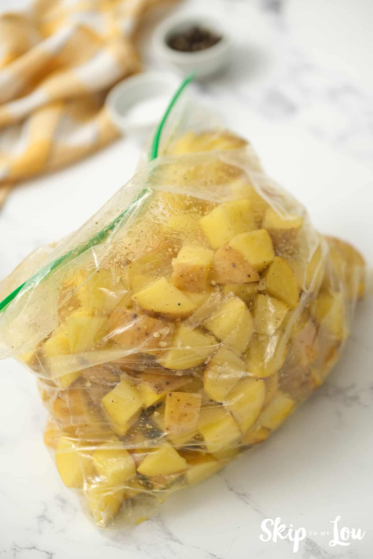 toss potatoes in bag