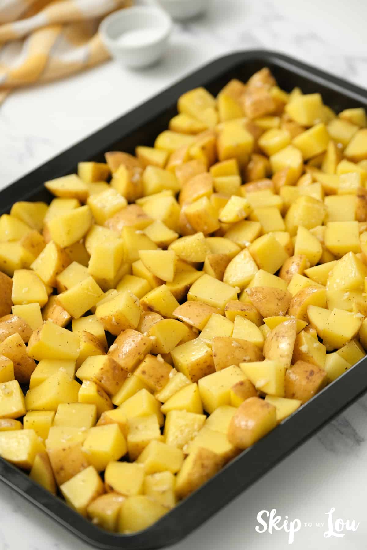spread potatoes evenly in pan