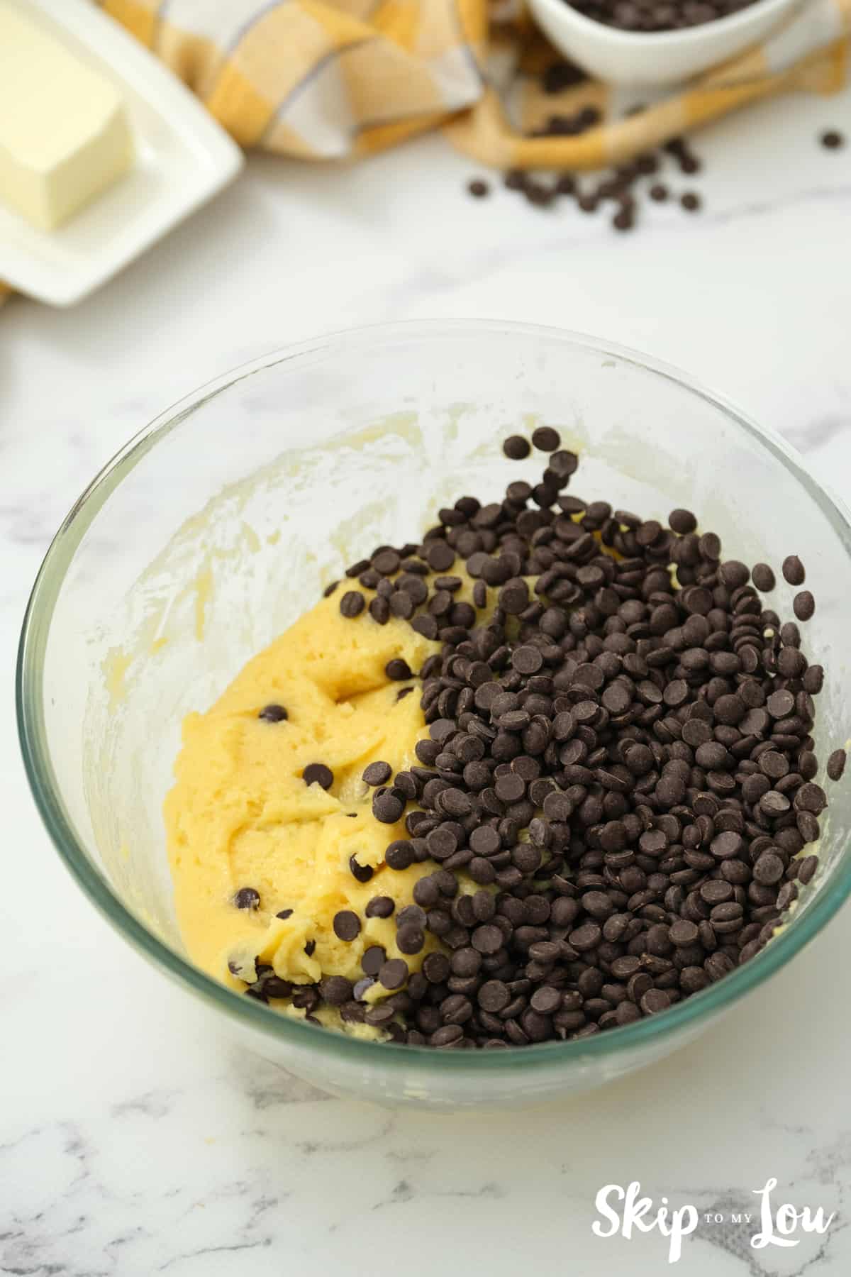 Add chocolate chips to the cake mix dough for cookie bars.