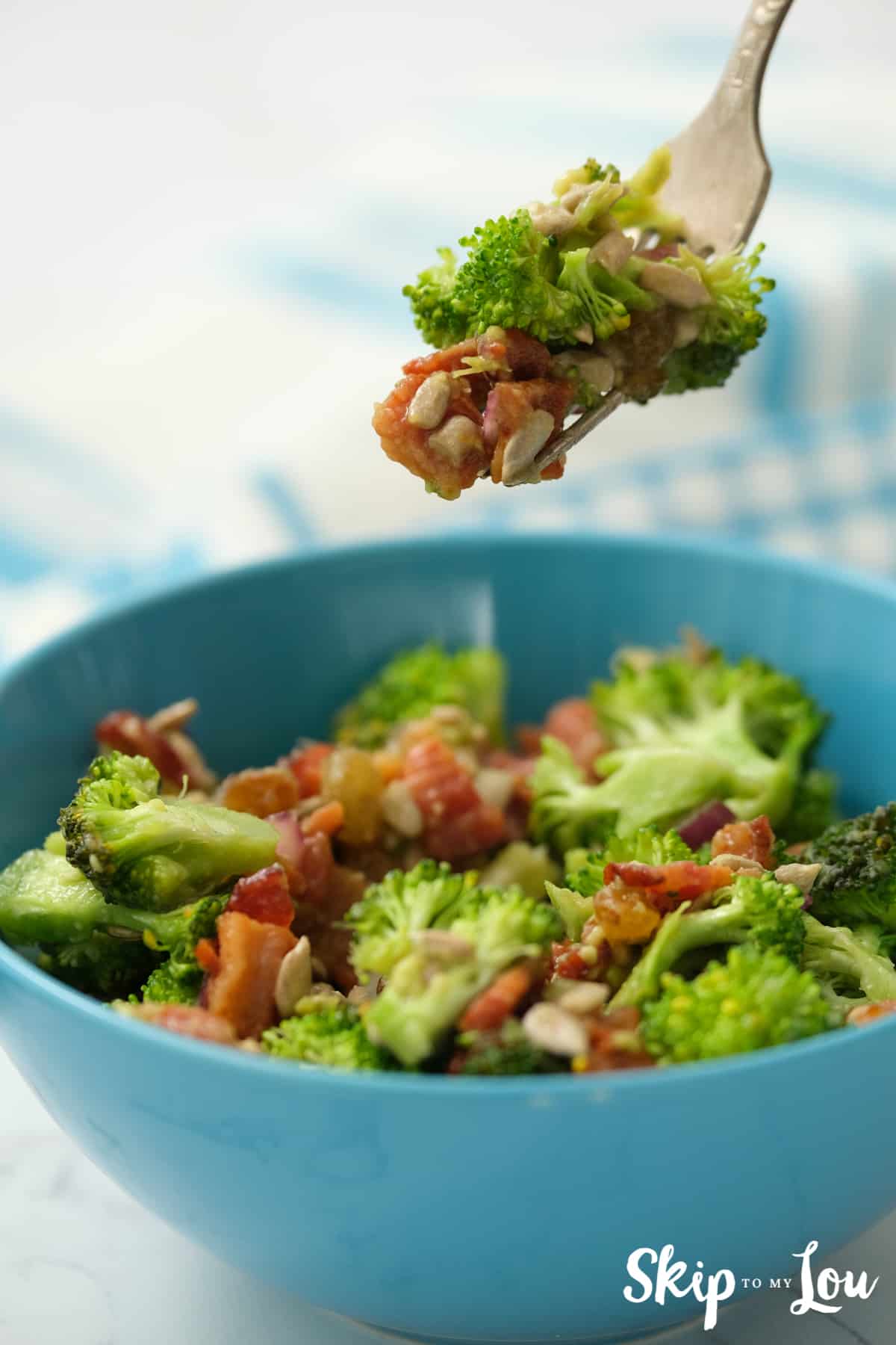 healthy broccoli salad in blue bowl