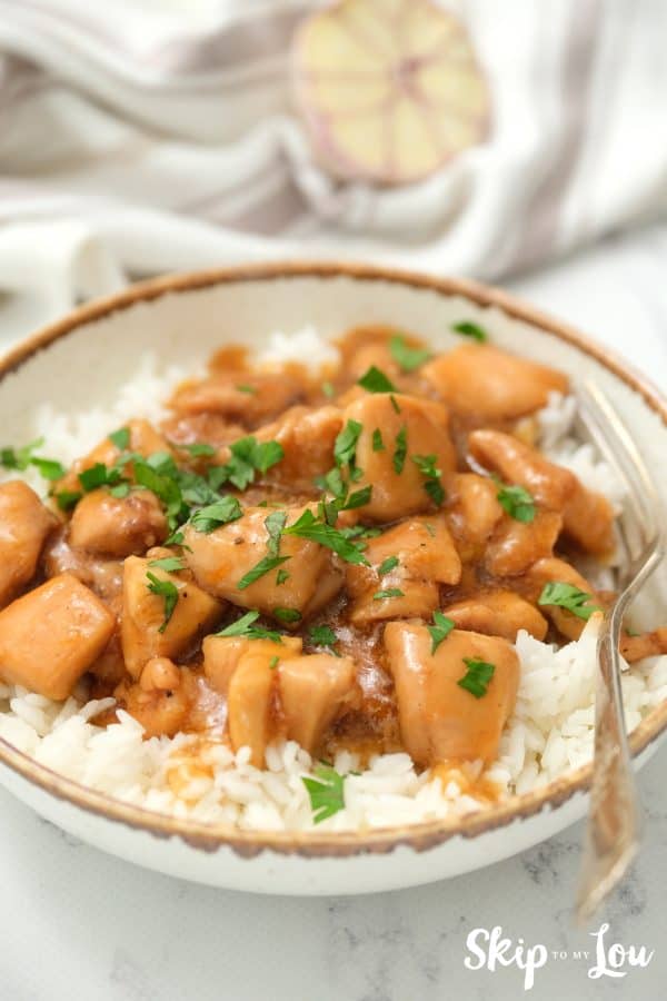 Easy Instant Pot Honey Chicken served on a gold rimmed white dish.
