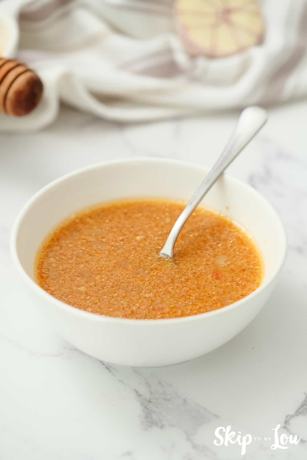 Mixture of sauce with cornstarch to thicken the honey chicken .