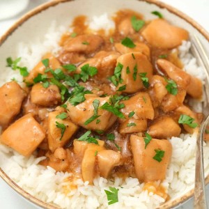 Instant Pot Honey Chicken served on a gold rimmed white dish. Delicious!