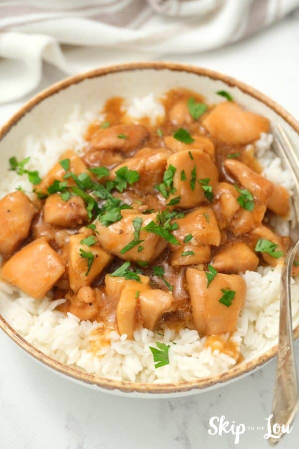 Instant Pot Honey Chicken served on a gold rimmed white dish. Delicious!