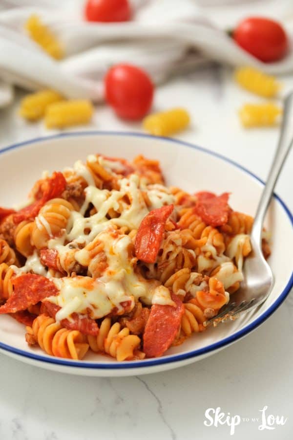 One Pot Pizza Pasta served in a blue lined white dish.