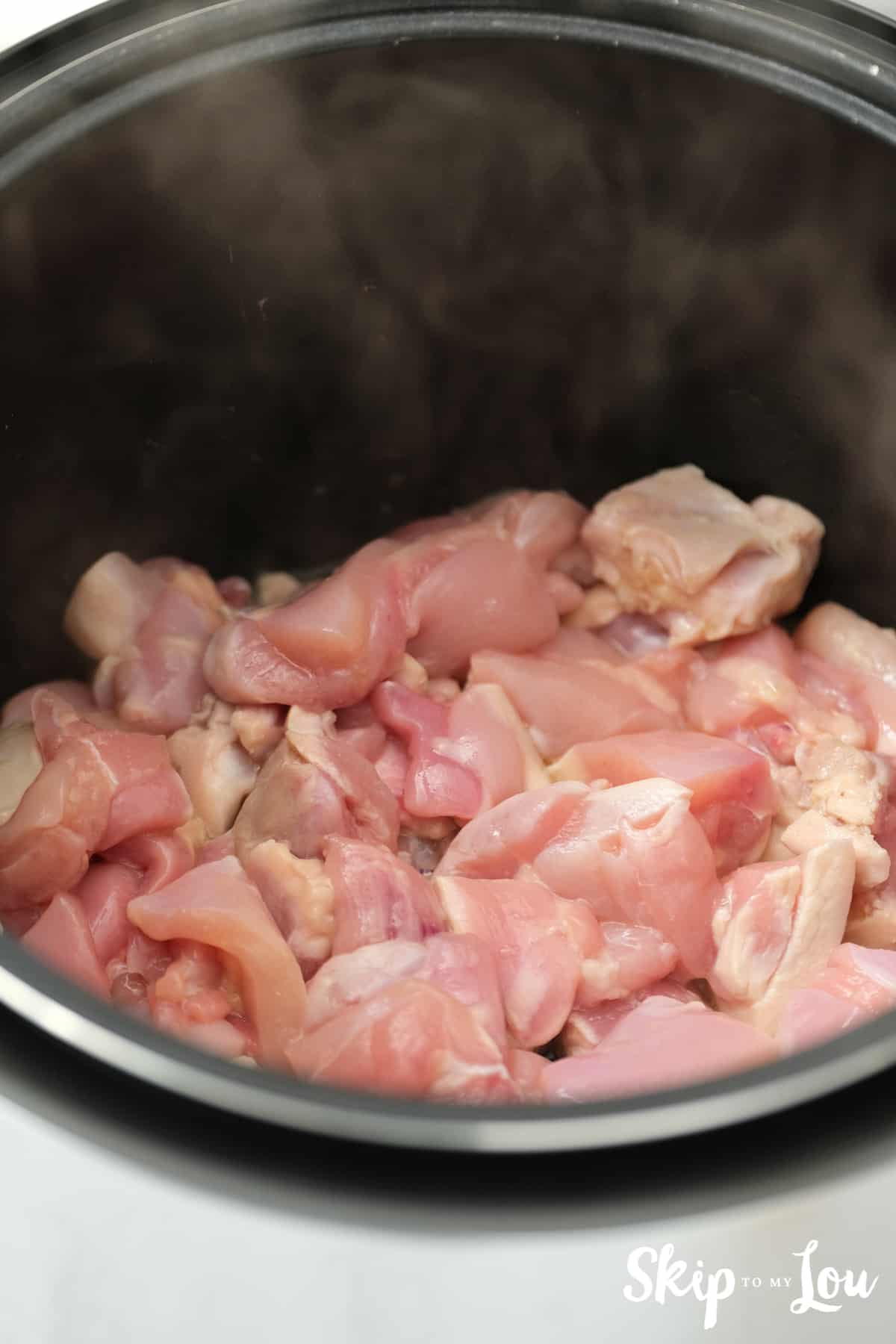Cut chicken into pieces for the honey bourbon chicken