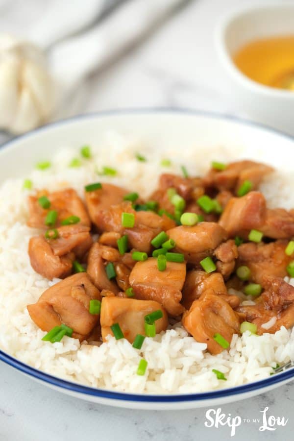 Yummy honey bourbon chicken served in a white dish.