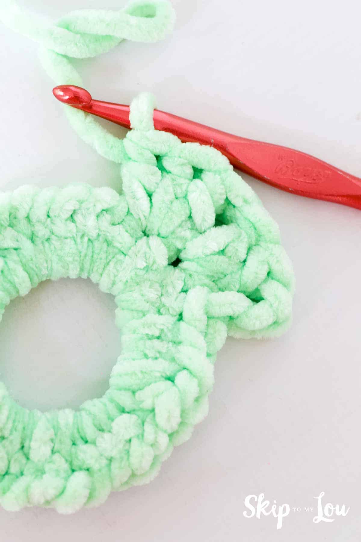 double crochet around elastic hair tie for crochet scrunchie