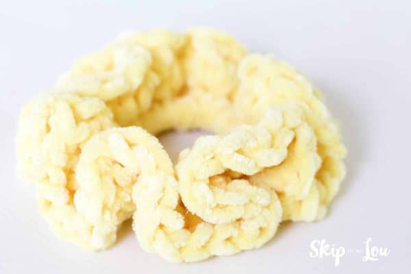 Finished pale yellow crochet scrunchie using velvet yarn