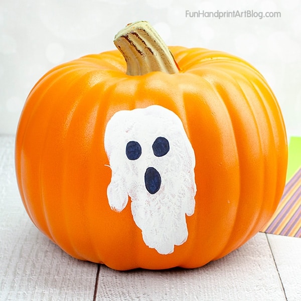 pumpkin with white handprint ghost on front