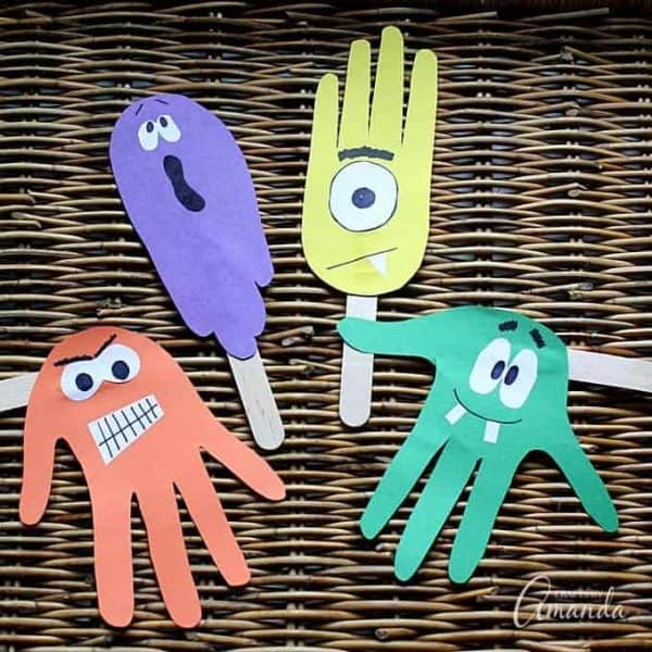 construction paper handprints on popsicle sticks to make puppets