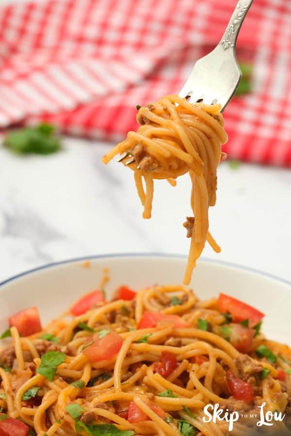 Yummy bite of Mexican Spaghetti rolled on a fork.