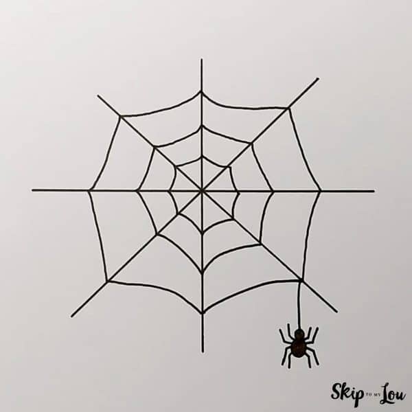 Final step for the spider web drawing. Add the spider coming off the right side of the web.r