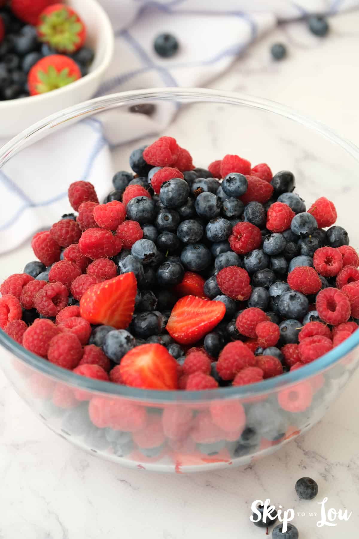 All the berries for the Triple Berry Pie combined in a glass bowl.