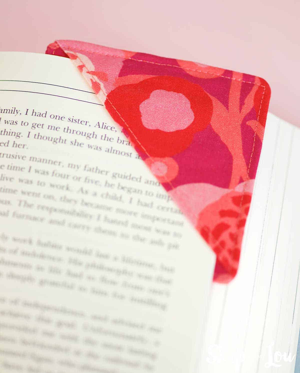 fabric corner bookmark on page in a book