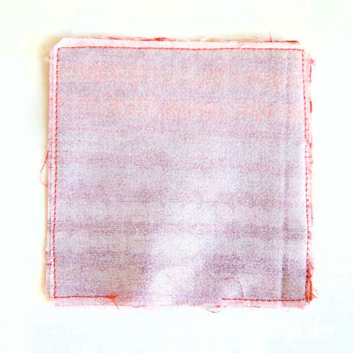stitch all the way around the edge of the fabric squares