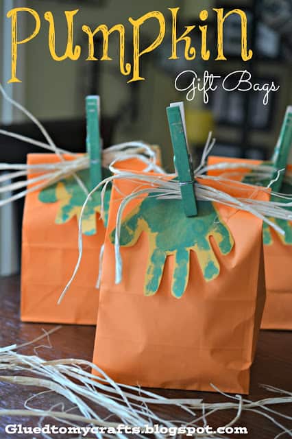 orange sacks with green handprint for favor bags
