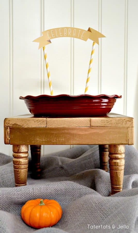 Free printable cake topper attached to yellow striped straws. "Celebrate"