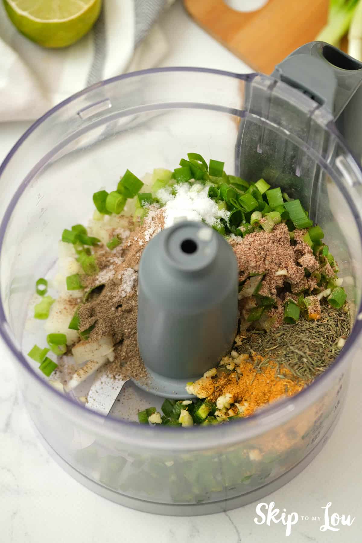 Combine ingredients for the Jerk Chicken Recipe in a food processor. -Skip To My Lou