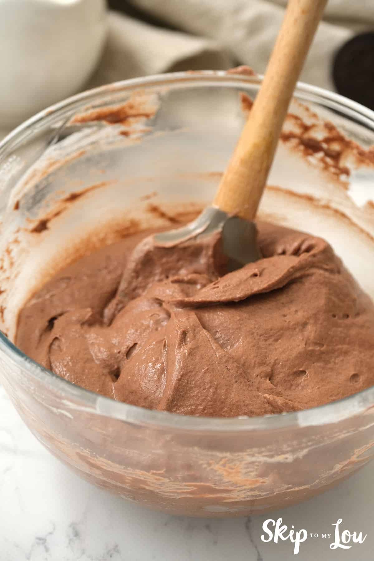 Cool whip gently stirred into the chocolate pudding.