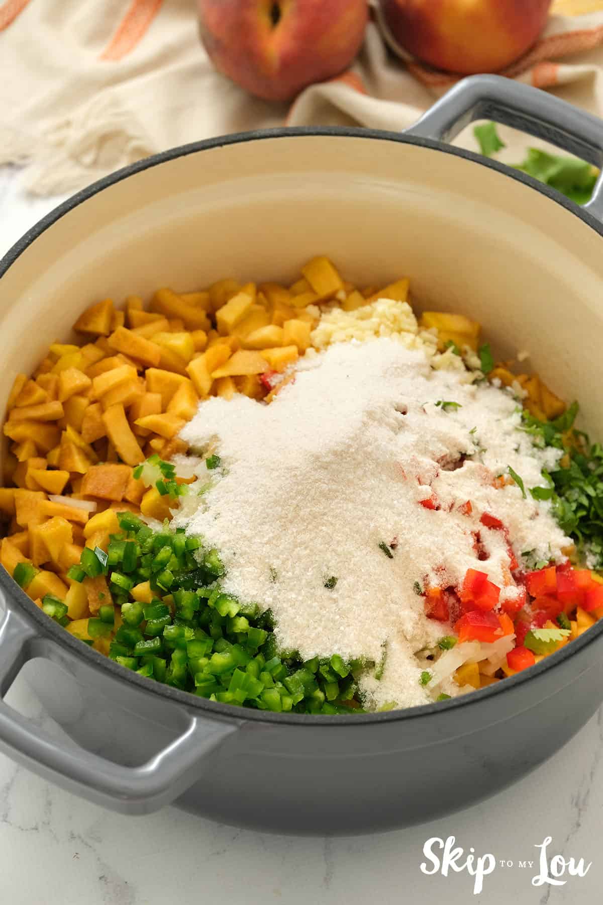 Large sauce pan with ingredients for the Peach Salsa
