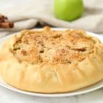 Baked until golden Rustic Apple Pie served on a white platter.