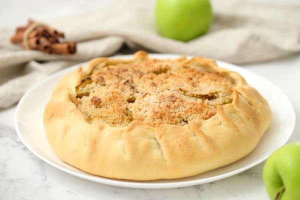 Baked until golden Rustic Apple Pie served on a white platter.