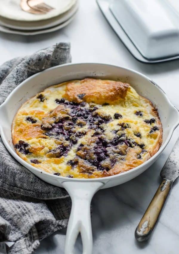 Image shows a pan with a dutch  baby/german pancake.
