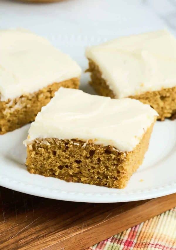 Image shows three slices of sourdough pumpkin cake.