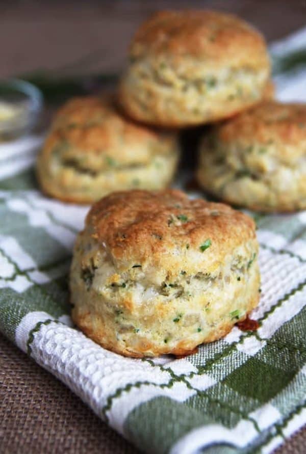 Image shows several cheese and chive sourdough biscuits