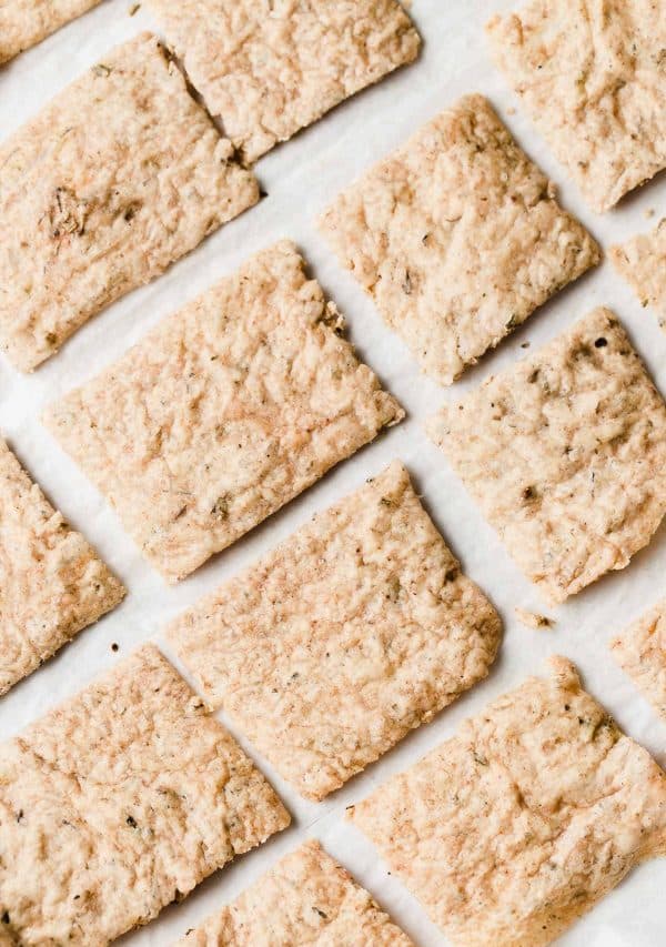 Image shows a batch of sourdough discard crackers.