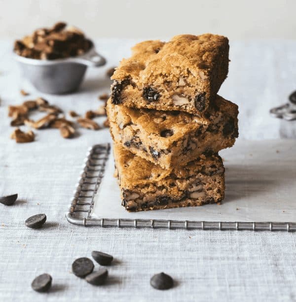 Image shows three blondies with chocolate chips made with sourdough.