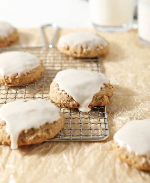 Image shows sourdough oatmeal cookies on a baking tray.