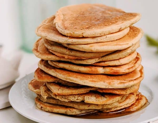 Image shows a stack of sourdough pancakes