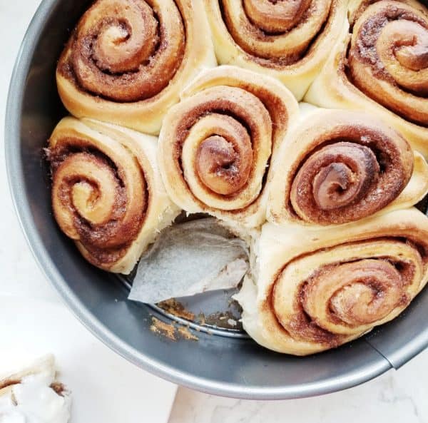 Image shows a plate with sourdough cinnamon rolls.