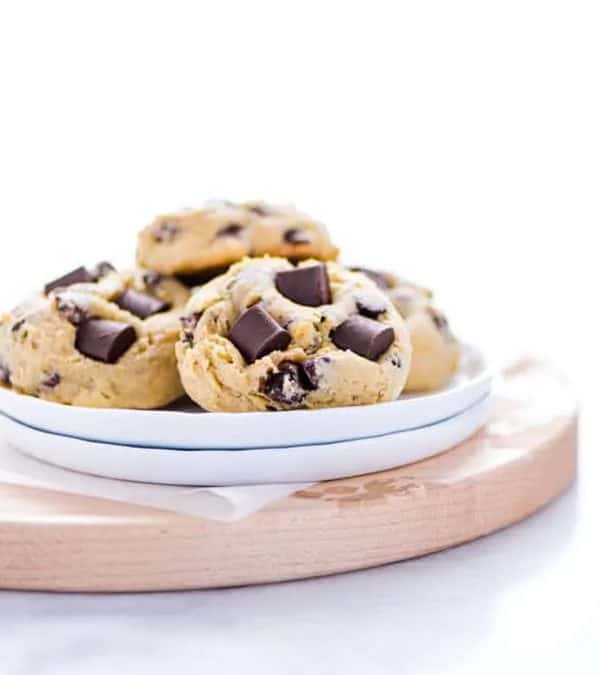 Image shows a plate with chocolate chip cookies made with sourdough.