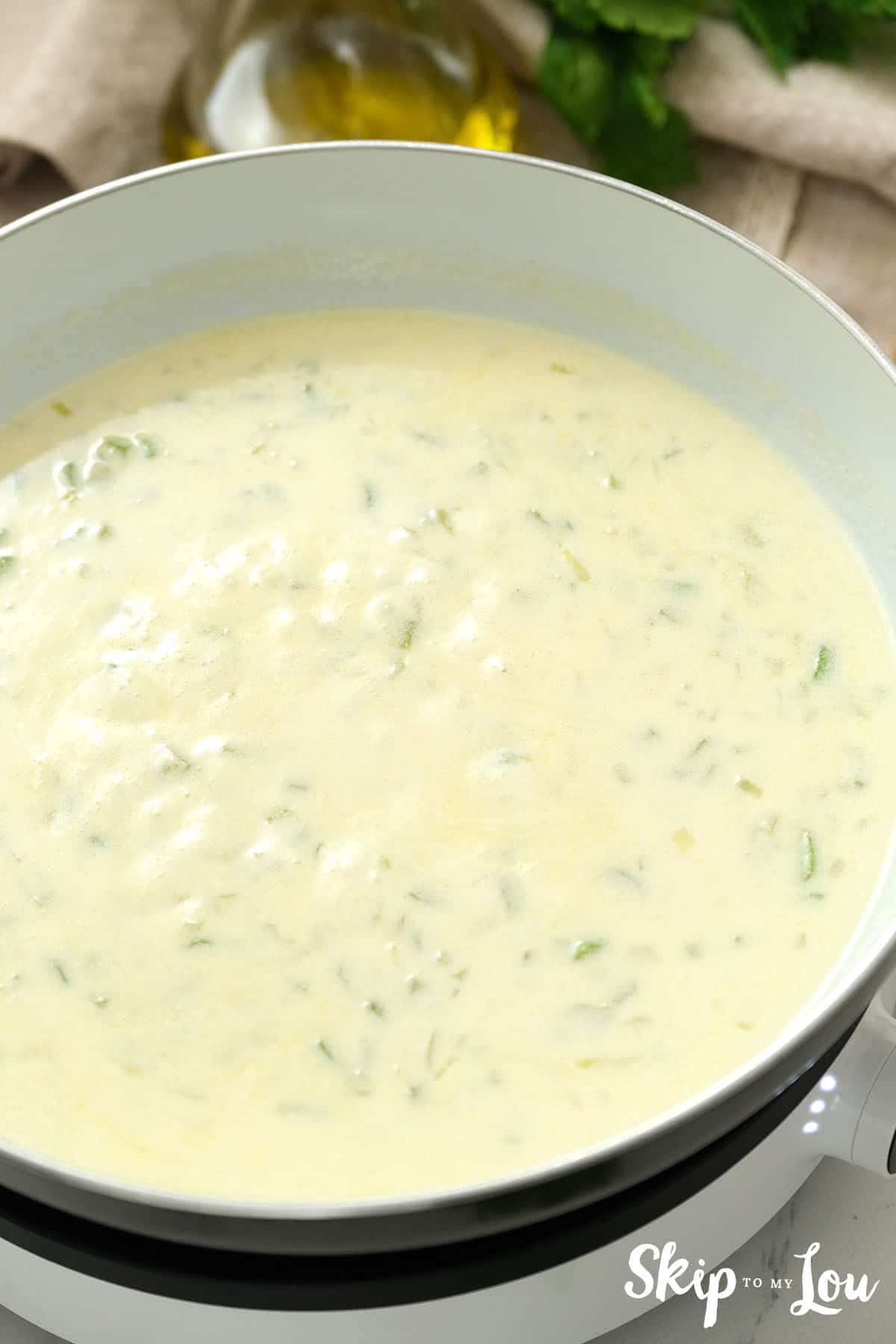 Large pan with cream added to the cooked celery and onions for the Tuna Noodle Casserole.
